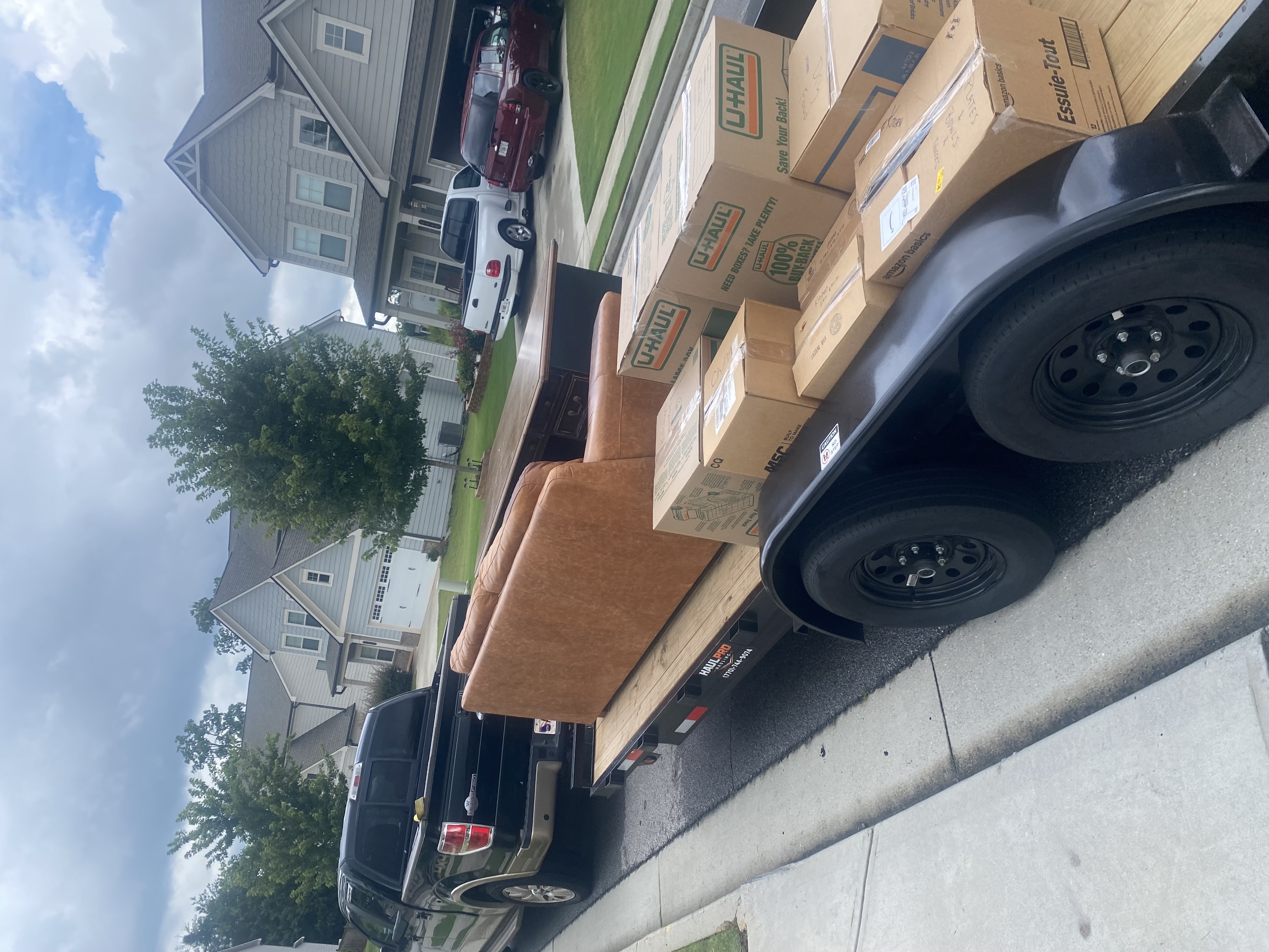 Movers carrying furniture during a local residential move